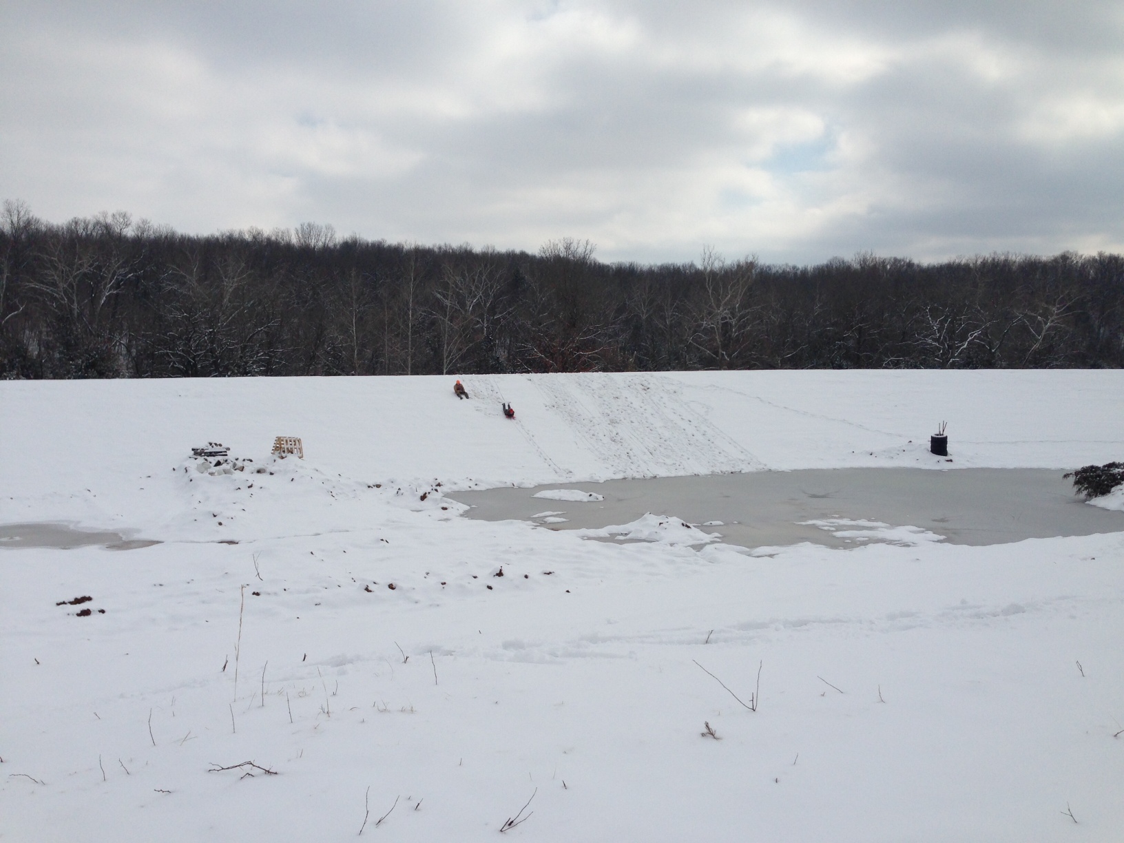 Attached picture pond w kids sledding.JPG